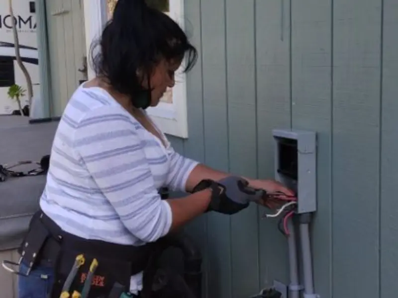 Licensed electrician wiring an exterior subpanel in Berea